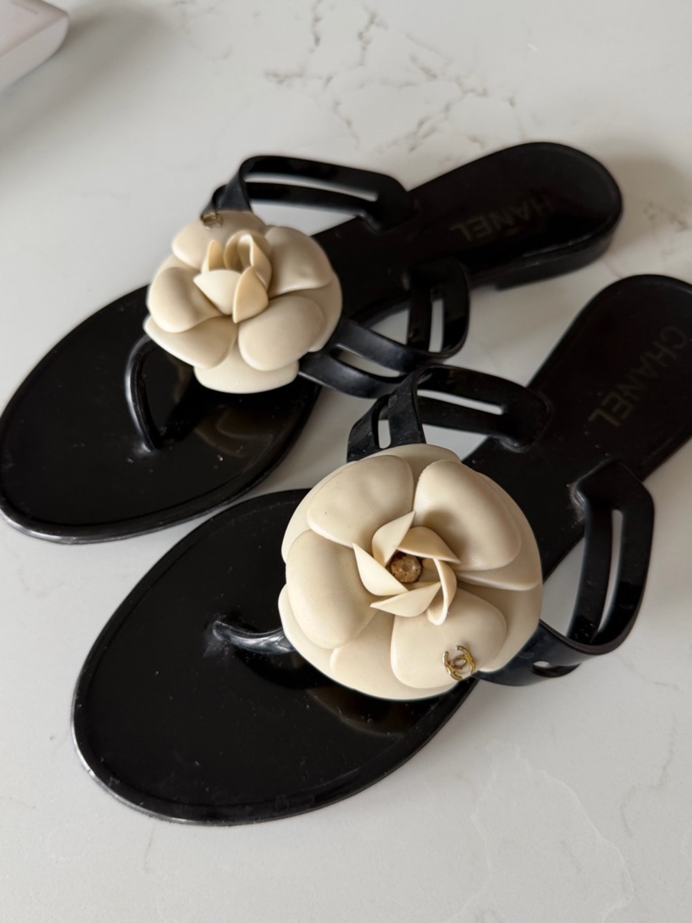 CHANEL Black Jelly Sandals with Ivory Camellia Accent